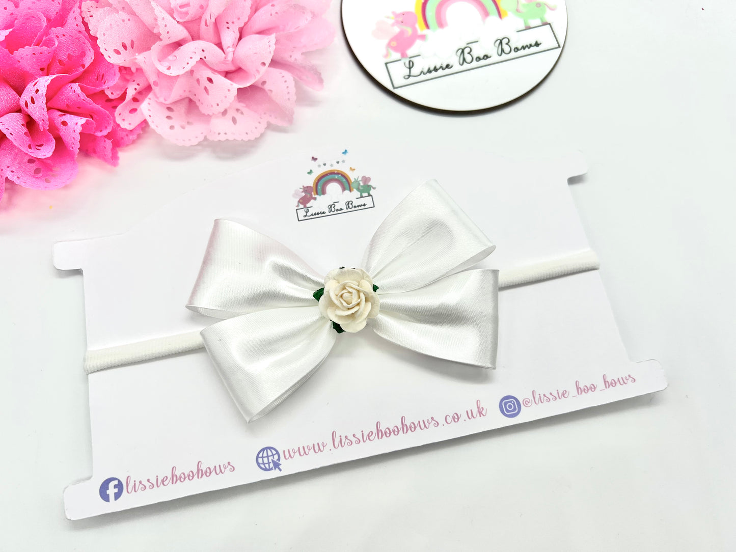 Satin bias floral hair bow - available as a clip, bobble or dainty baby headband