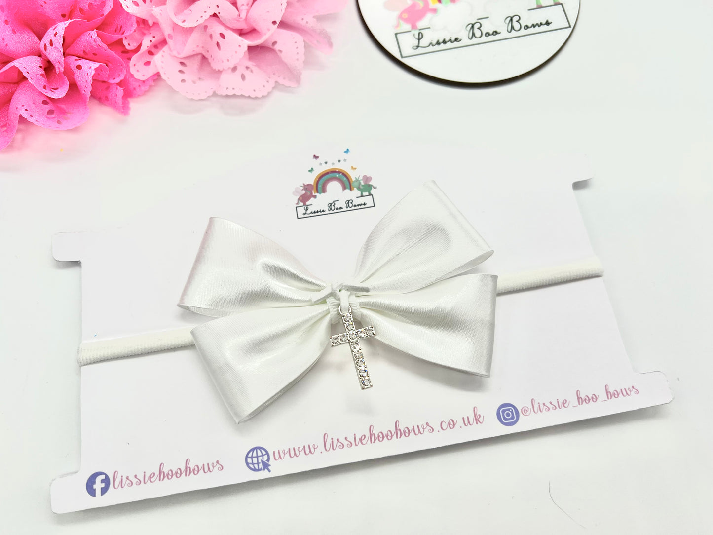 Satin bias cross charm hair bow - available as a clip, bobble or baby headband