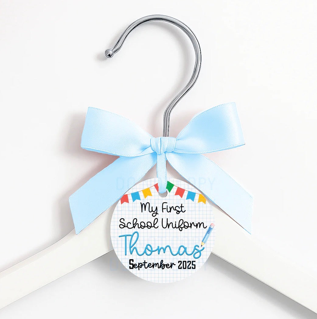 First day of … coat hanger, ribbon and tag