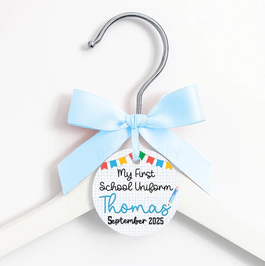 First day of … coat hanger, ribbon and tag