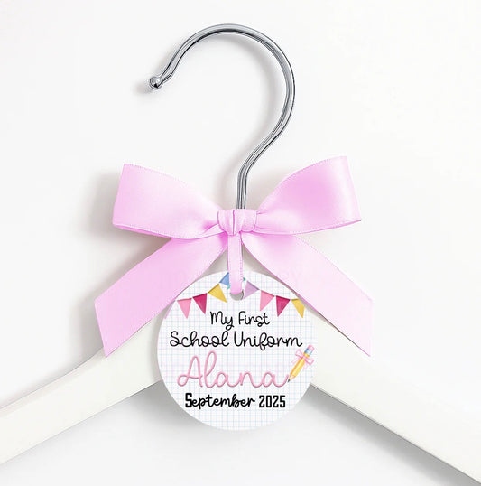 First day of … coat hanger, ribbon and tag