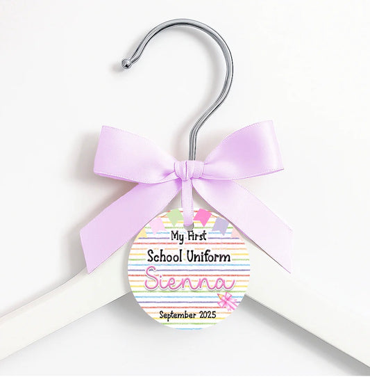 First day of … coat hanger, ribbon and tag