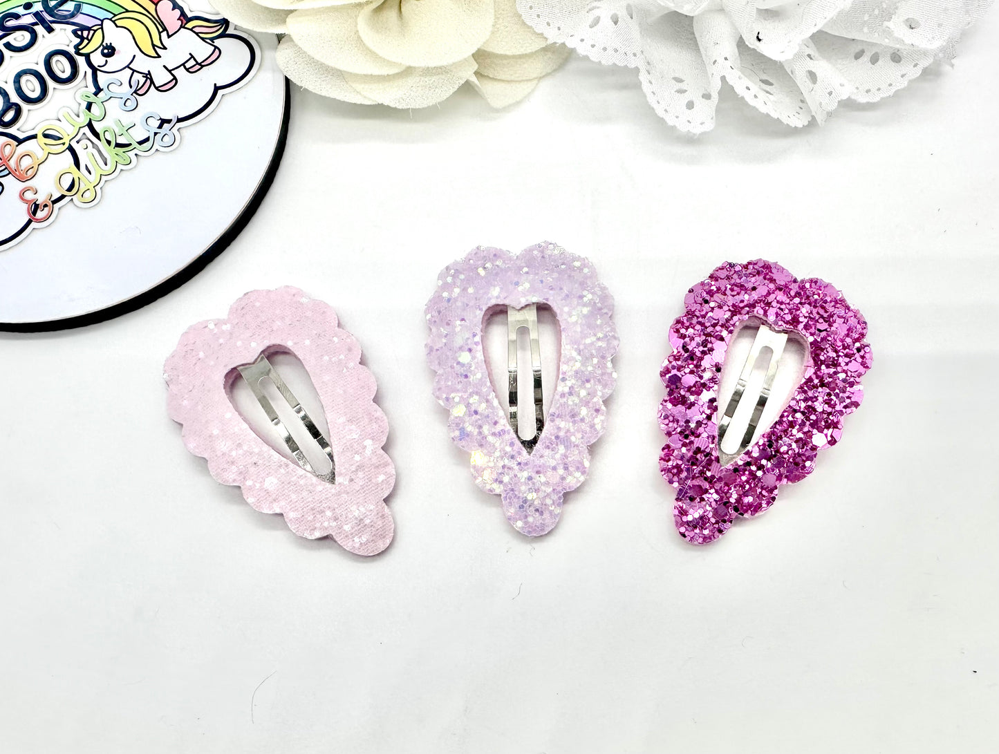 Set of three pink glitter heart hair clips